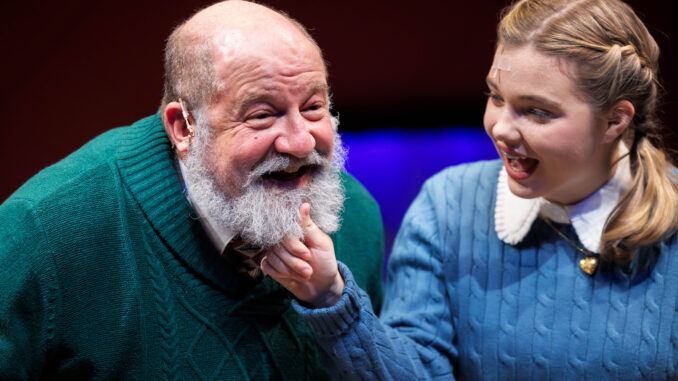 Kris Kringle gets his beard tugged by Susan Walker
